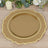 Gold decorative charger plate with scalloped edges on a wooden table.