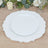 Elegant white decorative plate with scalloped edges on a wooden table.