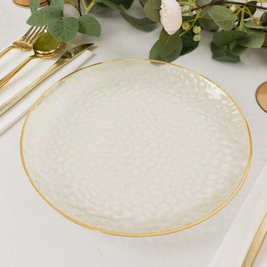 Elegant textured plate with gold rim, perfect for dining decor.