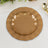 Brown decorative plates layered together on a light fabric background.
