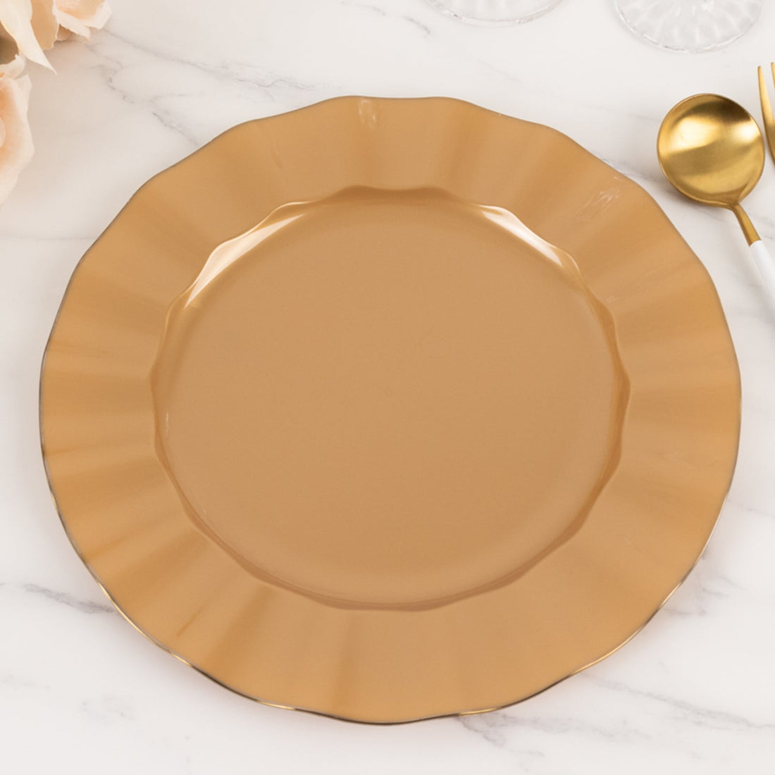 Brown scalloped dinner plate on marble surface