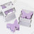Purple butterfly-shaped wax melts in a clear box on a reflective surface.