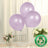 Three biodegradable lavender balloons floating above a table setting with flowers.