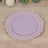 Lavender decorative plate with gold trim on a wooden table.