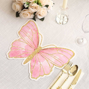 Pink butterfly table placemat with gold glitter accents on a white tablecloth.