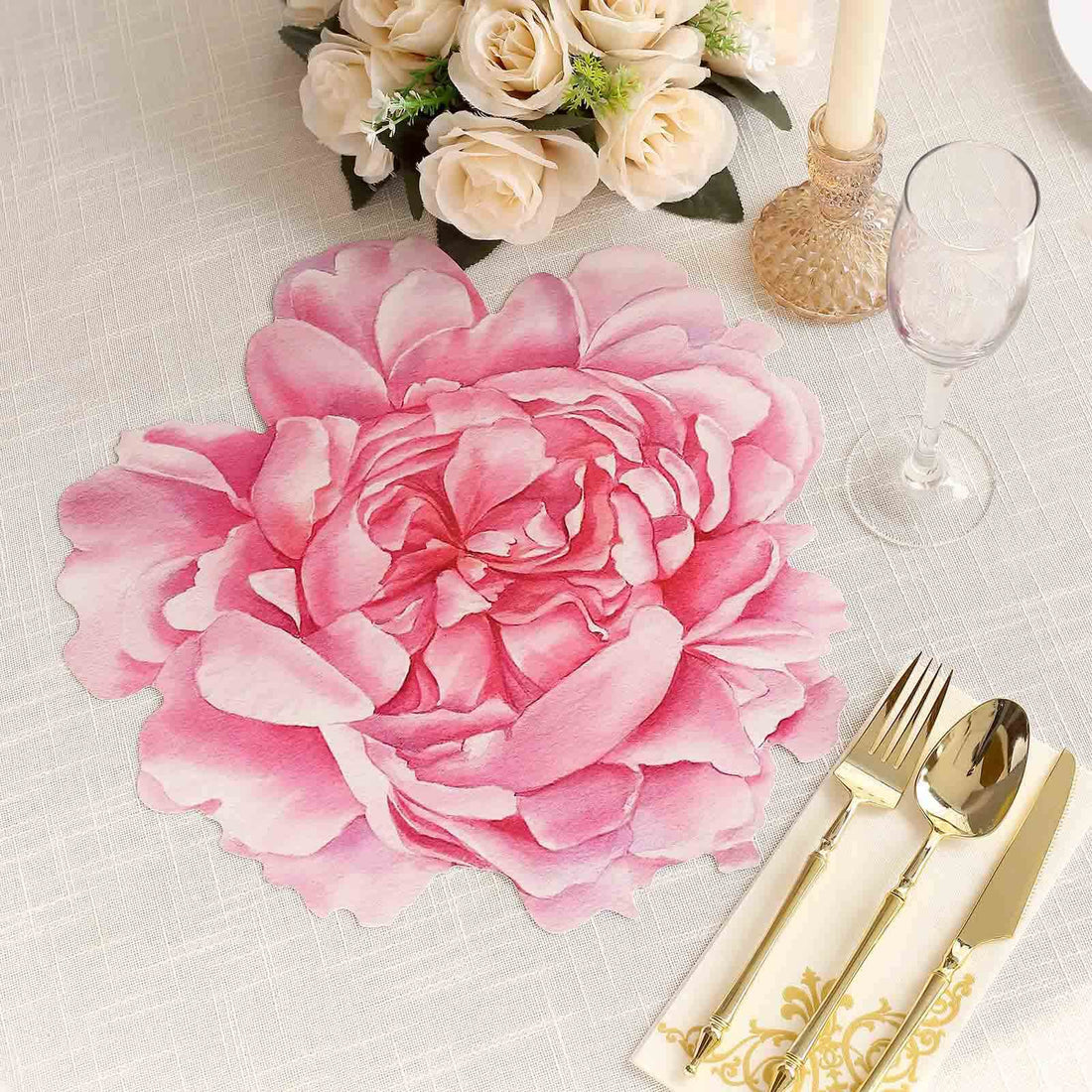 Pink floral table placemat with elegant dining setup and decor.
