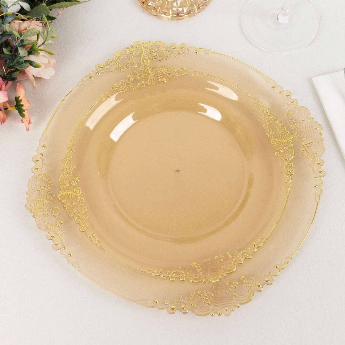 Elegant gold-accented clear dinner plate on a white backdrop
