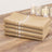 Set of four beige kitchen towels with white stripes.