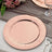 Rose gold textured charger plate on a table setting.