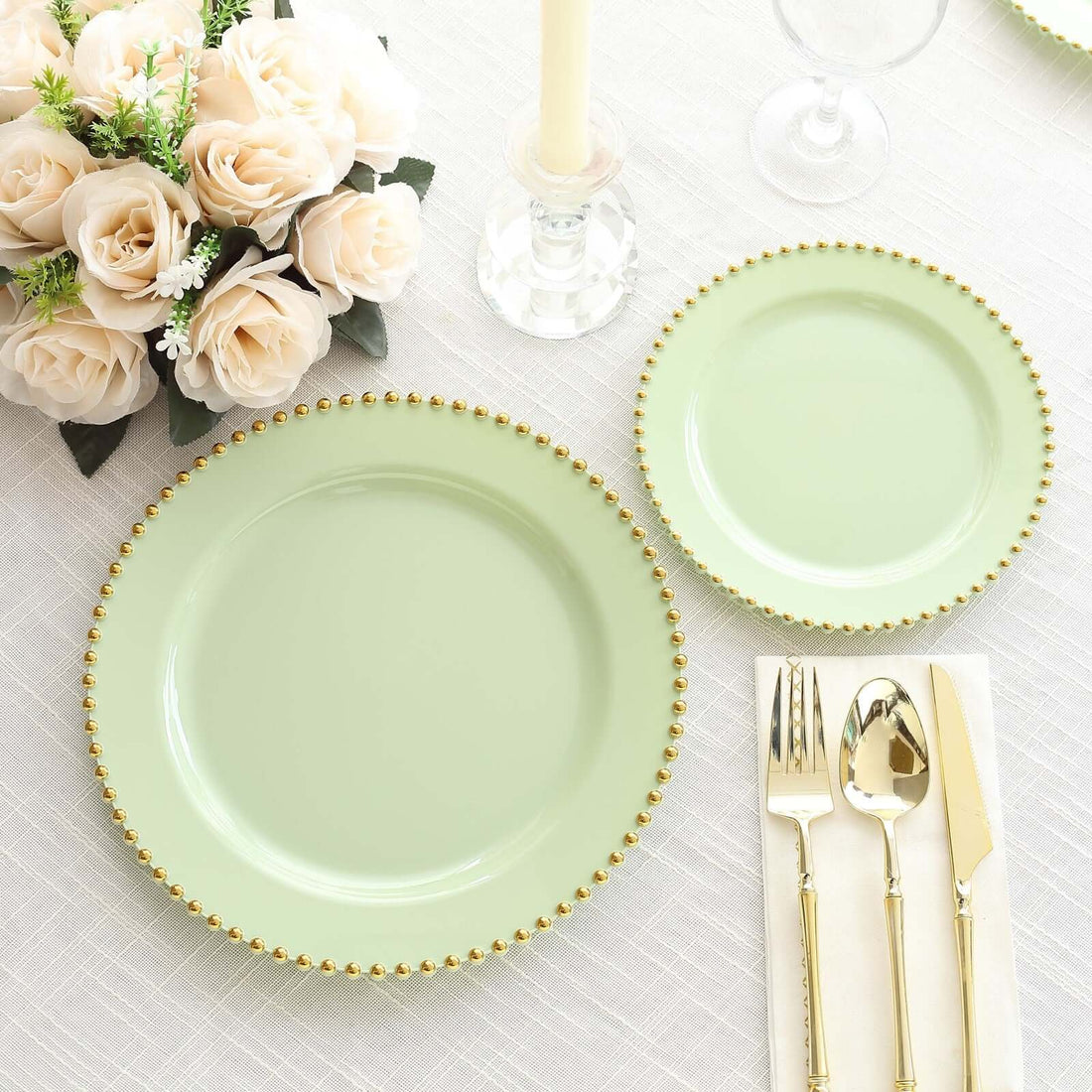 Mint green plates with gold bead trim on a textured table setting.