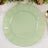 Mint green decorative plate with a scalloped edge on a light background.