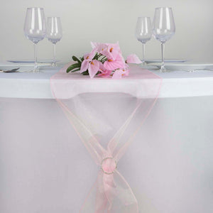 Pink table runner with flowers and glassware on a white table. #whtbkgd