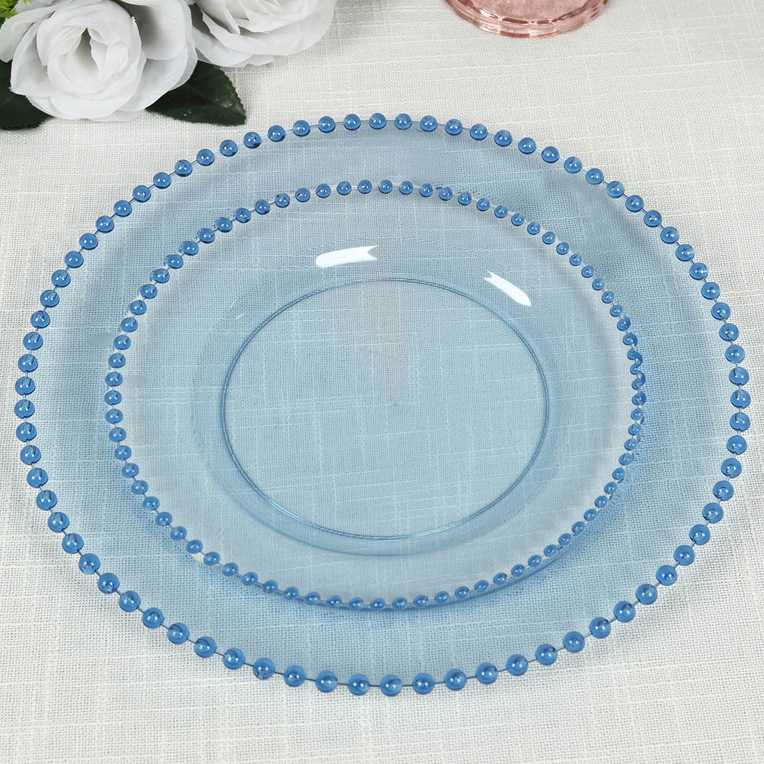 Set of three elegant blue decorative plates with beaded edges.