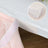 Table edge protectors in a soft pink and beige color scheme.