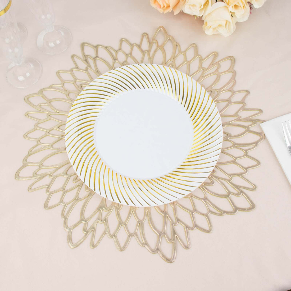Elegant gold-striped dinner plate on decorative lace placemat.