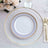 Elegant dining plate with gold and blue design on a decorative table setting.