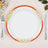 Elegant white plate with red and gold floral border, set on a neutral background.