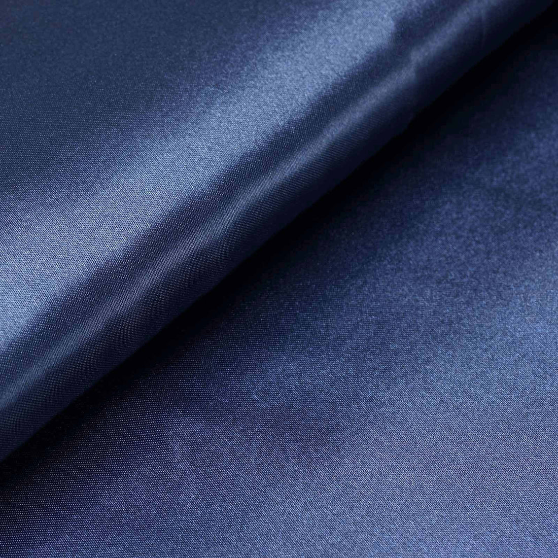Deep navy satin fabric with a smooth, luxurious finish. #whtbkgd