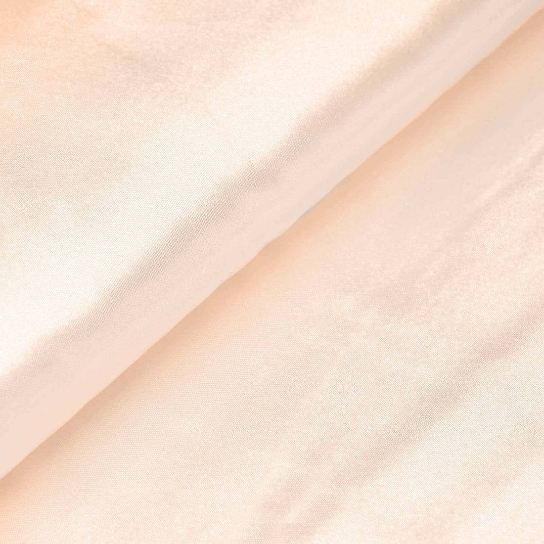Silky peach fabric showing smooth texture and sheen. #whtbkgd