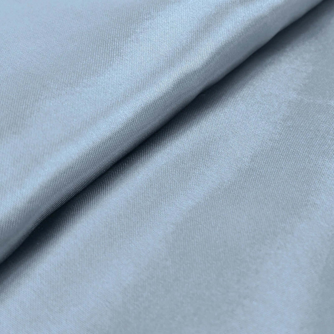 Close-up of soft blue fabric texture for fashion and design projects. #whtbkgd