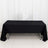 Black tablecloth draped over a rectangular table in a studio setting.