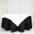 Black and white tablecloth with a triangular design on a round table