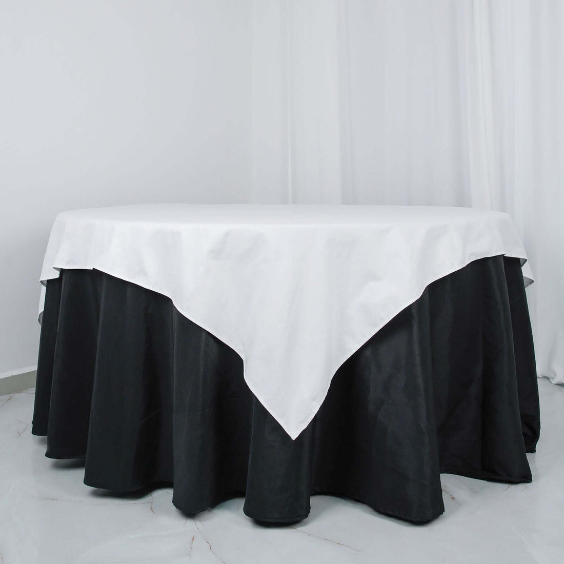 Round table with black and white tablecloth
