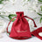 Red satin drawstring bag with logo, perfect for party favors or gifts.