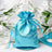 Blue satin drawstring bag with logo on a floral background.
