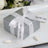 Personalized silver gift box with white ribbon and custom text.