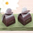Brown heart-shaped favor boxes with "AMOR" text, perfect for weddings or events. #whtbkgd