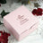 Personalized pink wedding favor box with custom text.