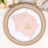 Personalized pink napkins with gold lettering on elegant tabletop setting.