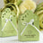 Personalized green wedding favor boxes with heart design and ribbon. #whtbkgd