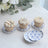 Assorted decorative cupcakes on floral plates.
