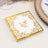 Elegant wedding napkin with gold foil design and personalized names and date.