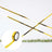 Gold washi tape on a white backdrop, ideal for crafts and decorations.