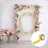 Floral arch decoration with pastel flowers and geometric accents.