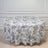 Floral round tablecloth with intricate black and white pattern on a table.