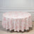 Round floral tablecloth in pink and white on a light background.
