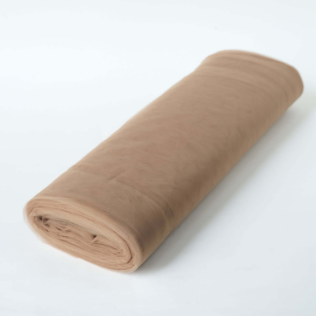 Roll of beige tulle fabric on a white background