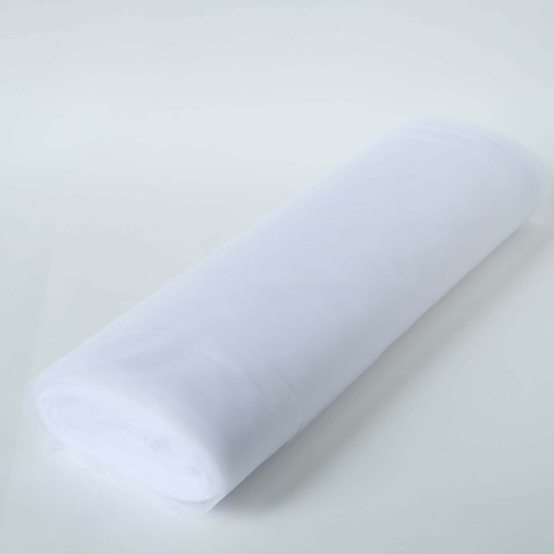 White fabric roll on a plain background