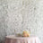 Elegant wedding table setup with floral decor and champagne glasses.