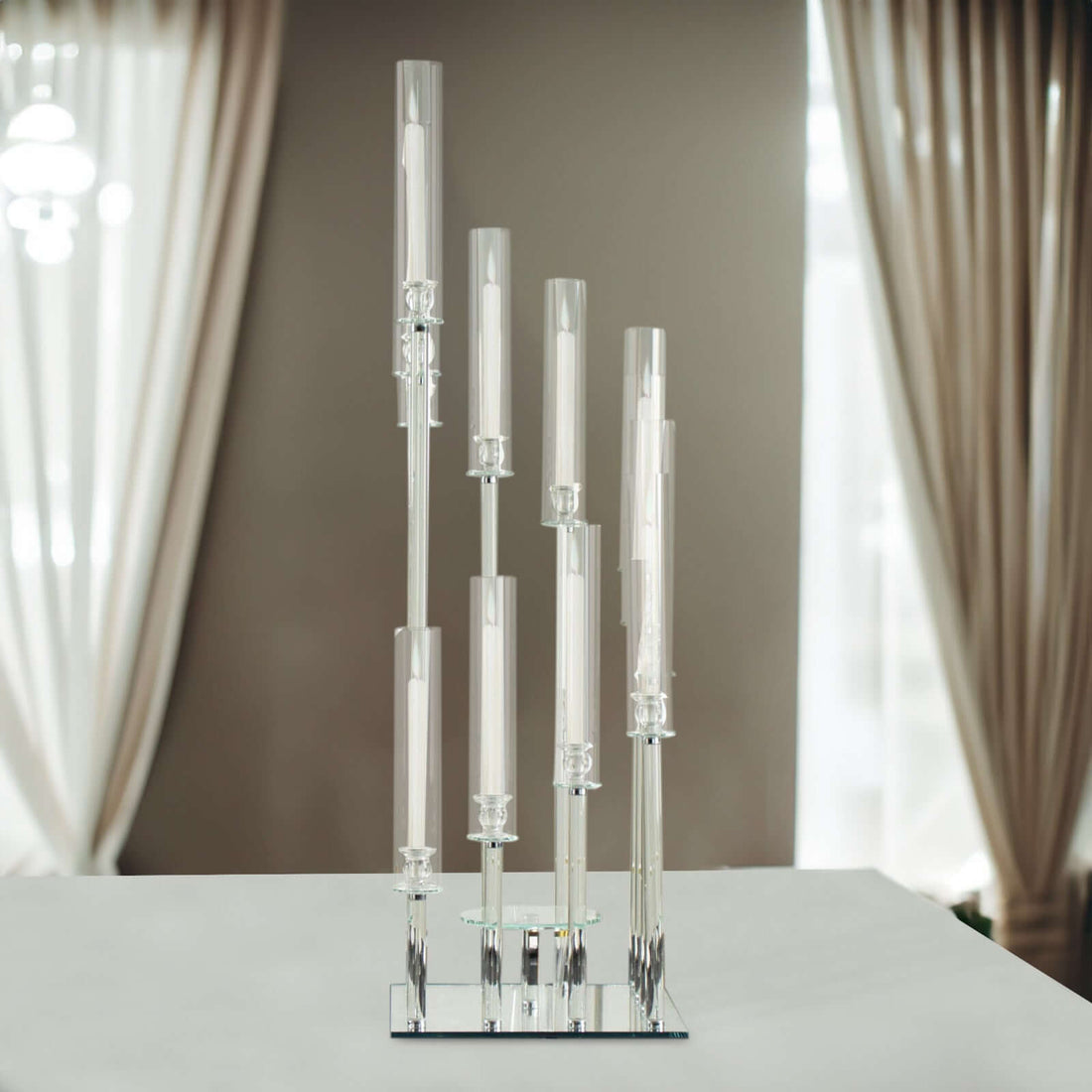 Elegant candle holder with multiple glass tubes and candles.