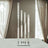 Elegant candle holder with multiple glass tubes and candles.