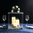 Elegant candle holder with flowers, perfect for table settings and decor.