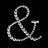Rhinestone ampersand design on black background.