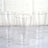 Clear plastic cups set on a marble surface, showcasing their sleek design.