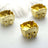 Golden decorative carts on a plain background