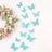 Decorative turquoise lace butterflies with floral wreath on white background